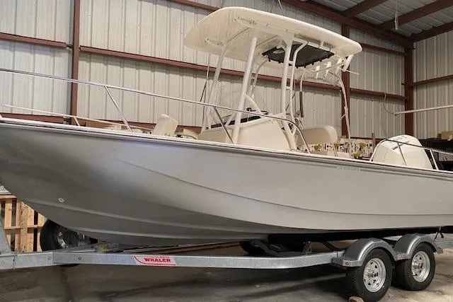 The Image of 2026 Boston Whaler 210 Montauk boat on trailer in indoor storage facility. - 0