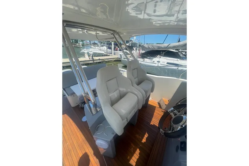 Slide: The Image of 2015 Faeton Formentera boat interior with plush seating and wooden flooring. - 11