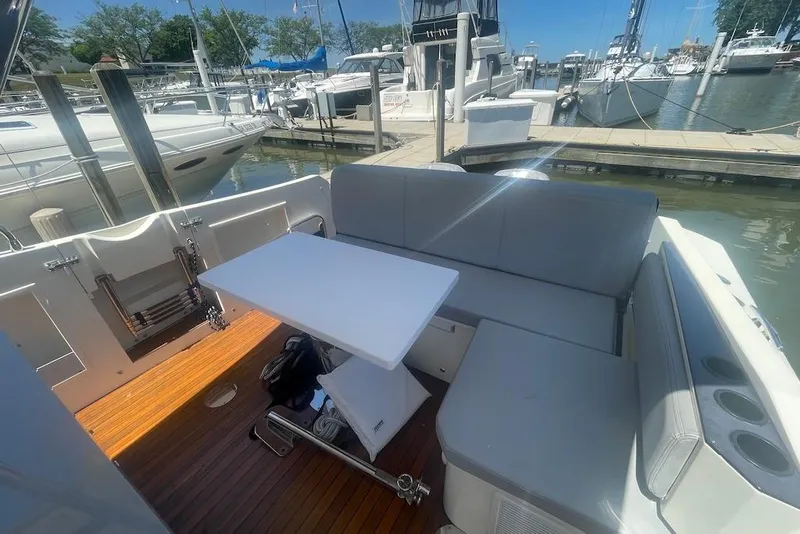 Slide: The Image of 2015 Faeton Formentera boat interior with seating and table at marina. - 13