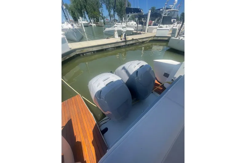 Slide: The Image of 2015 Faeton Formentera boat with dual outboard motors docked at marina. - 20