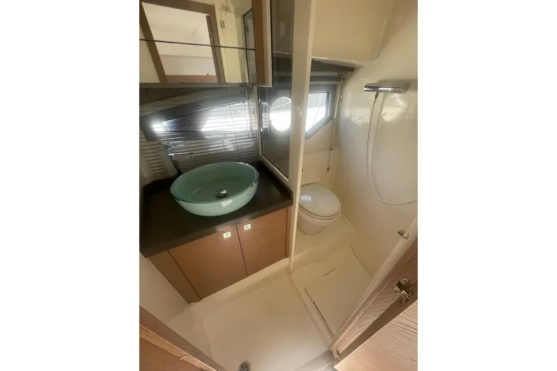 Slide: The Image of Compact bathroom in 2015 Faeton Formentera boat with sink, toilet, and shower. - 21
