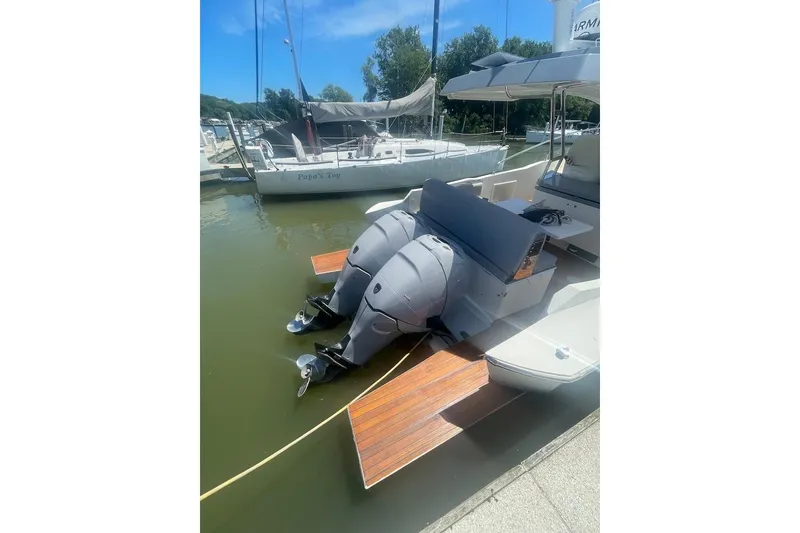 Slide: The Image of 2015 Faeton Formentera boat with dual outboard motors docked at a marina. - 23