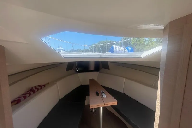 Slide: The Image of Interior of 2015 Faeton Formentera boat with seating and skylight view. - 26