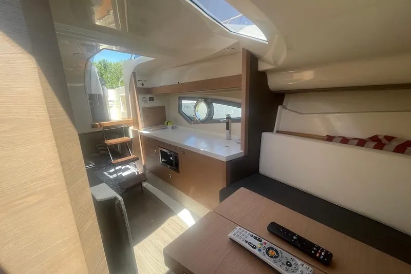 Slide: The Image of Interior of 2015 Faeton Formentera boat with modern kitchen and seating area. - 27