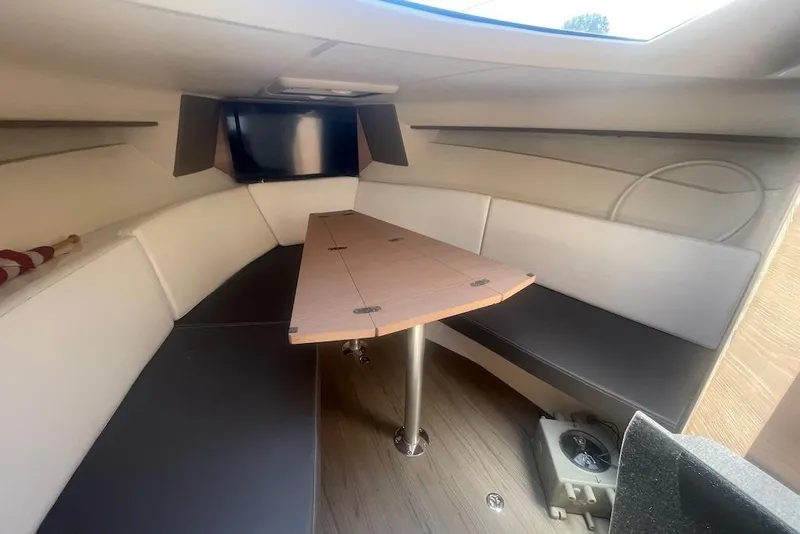 Slide: The Image of Interior of 2015 Faeton Formentera boat with seating and wooden table. - 28