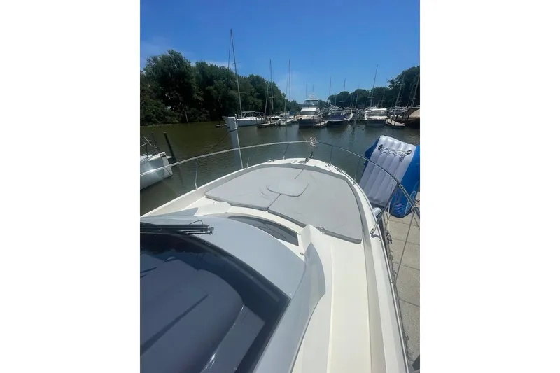 Slide: The Image of 2015 Faeton Formentera boat docked in a serene marina setting. - 6