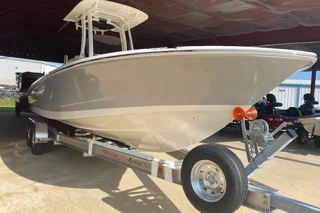 The Image of 2026 Boston Whaler 250 Dauntless boat on trailer in covered storage area. - 0