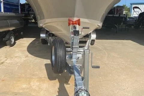 Slide: The Image of 2026 Boston Whaler 250 Dauntless boat on trailer, front view. - 12