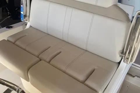 Slide: The Image of 2026 Boston Whaler 250 Dauntless boat seat, beige upholstery, sleek design. - 5