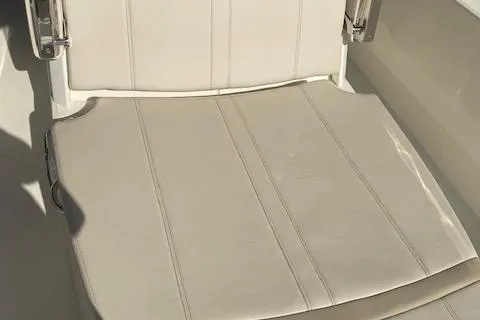 Slide: The Image of 2026 Boston Whaler 250 Dauntless boat seat, featuring white upholstery and sleek design. - 7