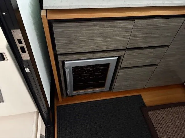 Slide: The Image of Interior of 2020 Tiara Yachts C49 Coupe with refrigerator. - 10