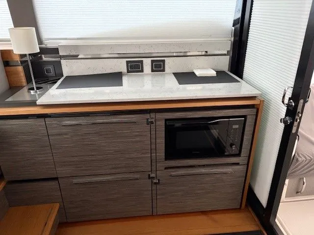 Slide: The Image of Modern kitchen in a 2020 Tiara Yachts C49 Coupe. - 11