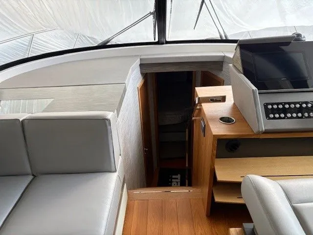 Slide: The Image of Interior of 2020 Tiara Yachts C49 Coupe with modern amenities. - 14