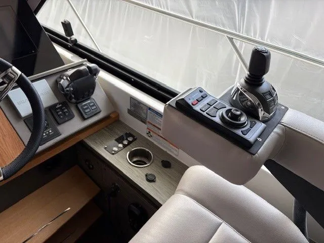 Slide: The Image of Interior view of a 2020 Tiara Yachts C49 Coupe helm. - 17