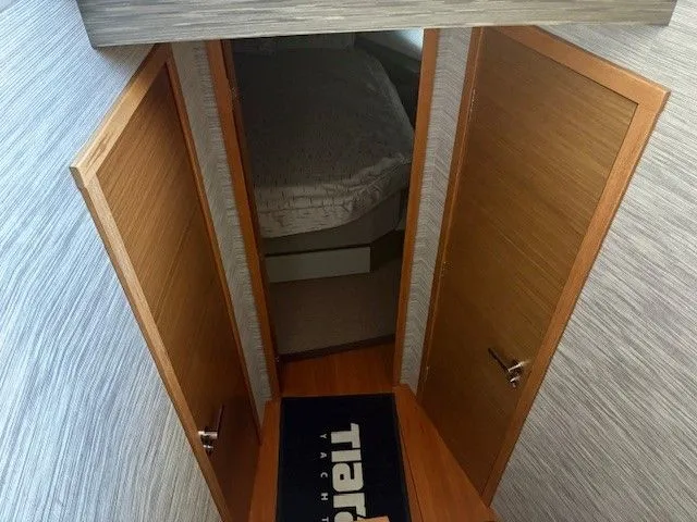 Slide: The Image of Interior of 2020 Tiara Yachts C49 Coupe with wooden doors. - 22