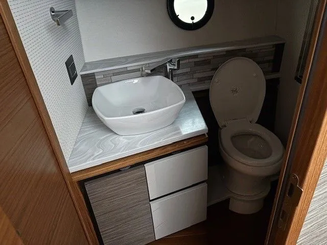 Slide: The Image of Luxurious bathroom in a 2020 Tiara Yachts C49 Coupe. - 28