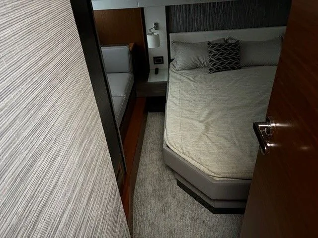 Slide: The Image of Interior of 2020 Tiara Yachts C49 Coupe with bed and sofa. - 29
