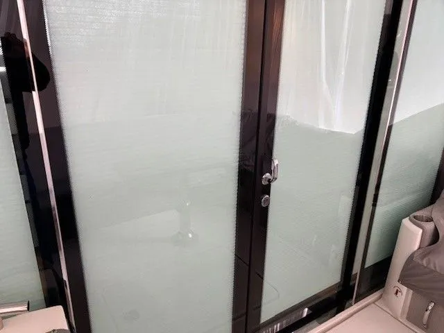 Slide: The Image of Tiara Yachts C49 Coupe 2020 with glass door. - 7