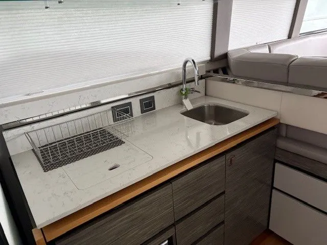 Slide: The Image of Modern kitchen on a 2020 Tiara Yachts C49 Coupe. - 9