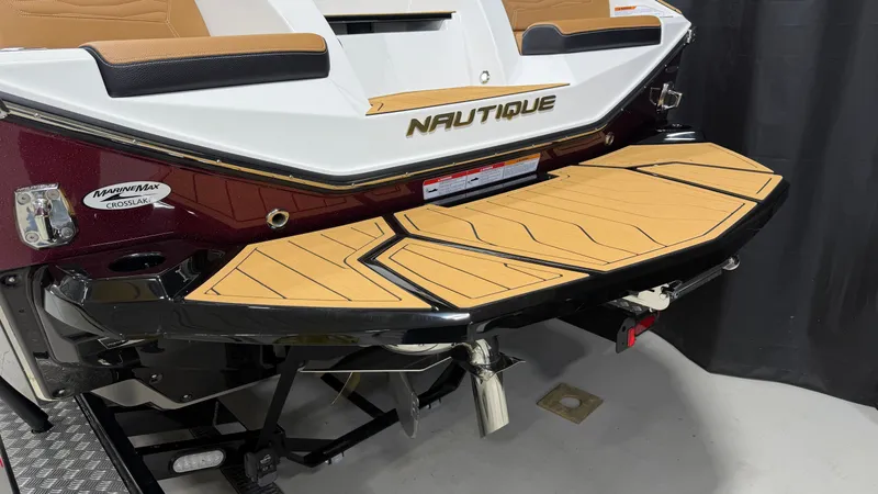 Slide: The Image of Rear view of a Nautique Super Air Nautique G23 with brown platform and black accent. - 10