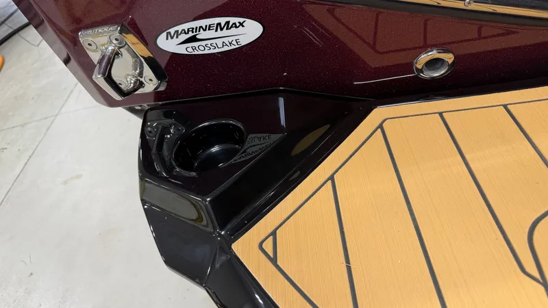 Slide: The Image of Stern of a Nautique Super Air Nautique G23 with MarineMax Crosslake logo. - 12