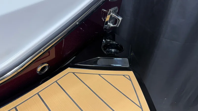 Slide: The Image of Close-up of a boat deck with a cup holder and sleek wood paneling. - 13
