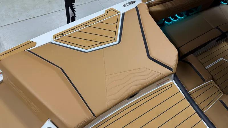 Slide: The Image of Close-up of the upholstery and flooring on a 2026 Nautique Super Air Nautique G23. - 17