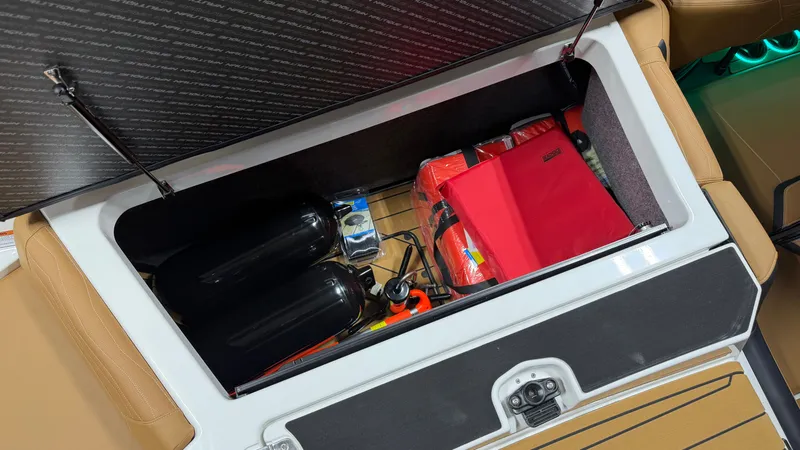 Slide: The Image of Boat storage compartment with safety gear and accessories. - 18