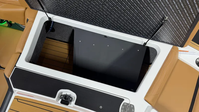Slide: The Image of Boat storage compartment with open lid, showing interior and upholstery. - 20