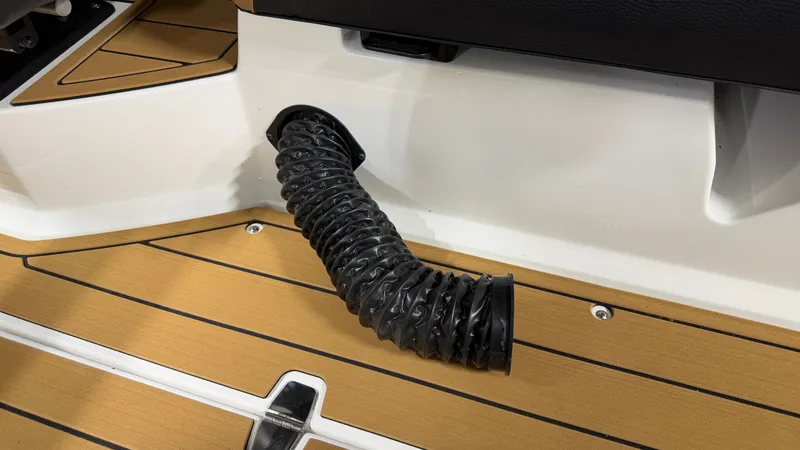 Slide: The Image of Air hose in a boat interior, surrounded by wood-patterned flooring. - 29
