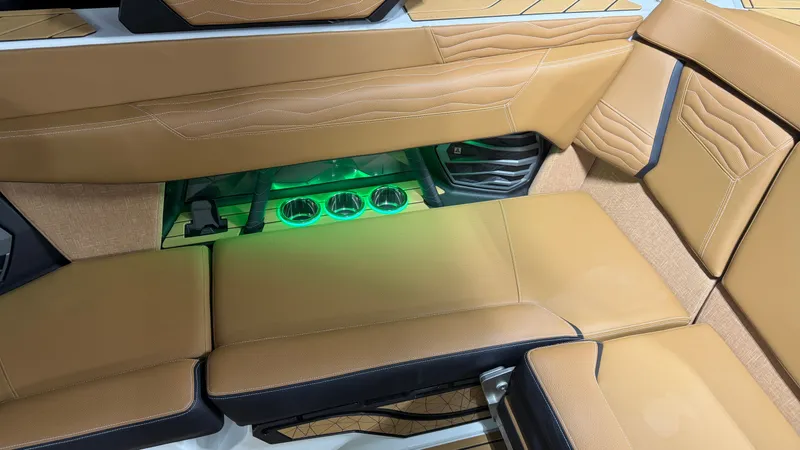 Slide: The Image of Interior of a Nautique Super Air Nautique G23 with beige upholstery and green lighting. - 30