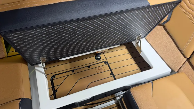 Slide: The Image of Storage compartment inside a boat with cushioned seating. - 35