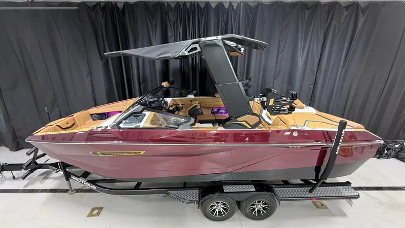 Slide: The Image of 2026 Nautique Super Air Nautique G23 in a showroom on a trailer. - 4