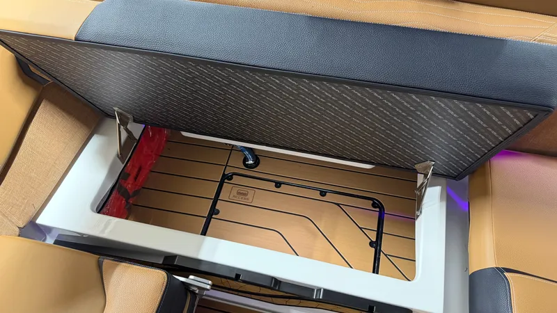 Slide: The Image of Boat storage compartment with wood paneling and cushioned lid. - 43