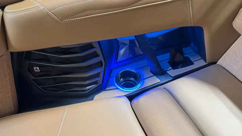 Slide: The Image of Interior of the Nautique Super Air Nautique G23 with blue lighting and speaker. - 47