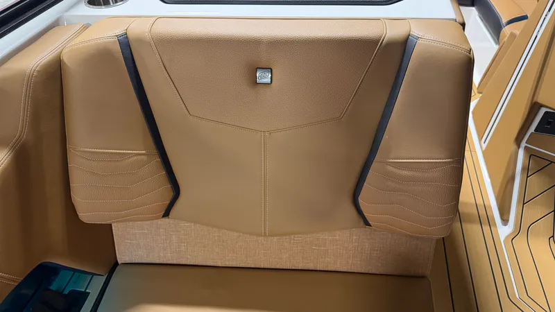 Slide: The Image of Interior of the Nautique Super Air Nautique G23 with brown upholstery and modern detailing. - 49