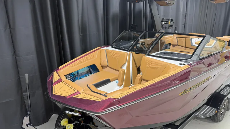 Slide: The Image of Nautique Super Air Nautique G23 from 2026 with luxurious interior, on a trailer in a showroom. - 5