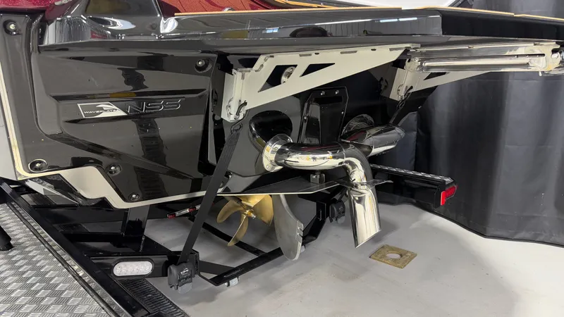 Slide: The Image of Rear view of a Nautique Super Air Nautique G23 with visible drive and propeller. - 9
