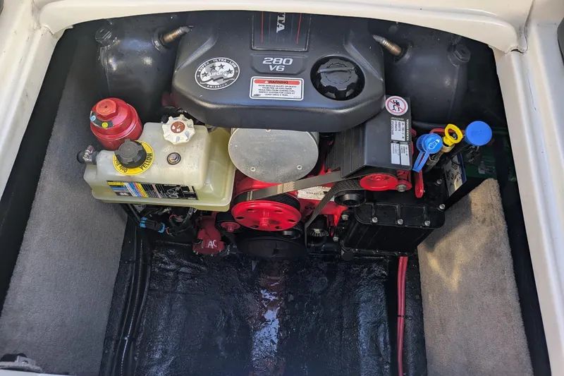 Slide: The Image of Engine compartment of a 2019 Stingray 250 CR boat, featuring a 280 V6 engine. - 21