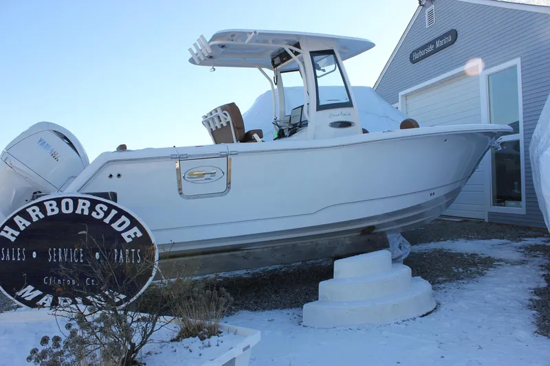 The Image of 2026 Sea Hunt Gamefish 25 boat at Harborside Marina in winter setting. - 0
