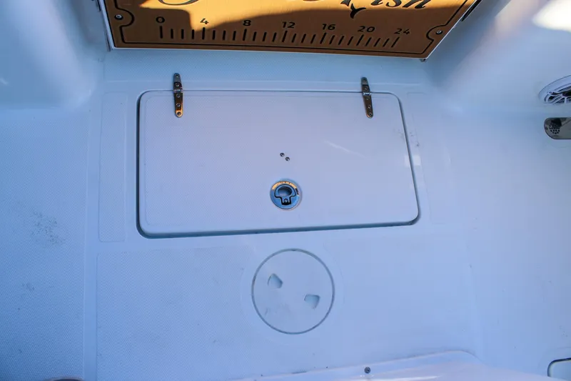 Slide: The Image of 2026 Sea Hunt Gamefish 25 deck with storage compartment and measuring board. - 12