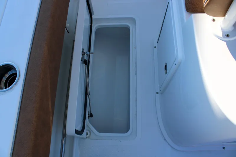 Slide: The Image of Open storage compartment on 2026 Sea Hunt Gamefish 25 boat. - 18
