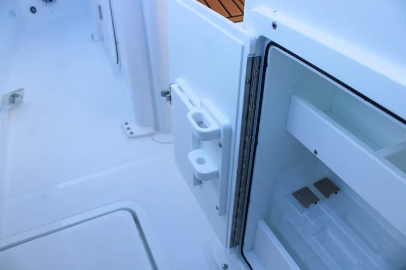 Slide: The Image of 2026 Sea Hunt Gamefish 25 boat interior with open storage compartment. - 20