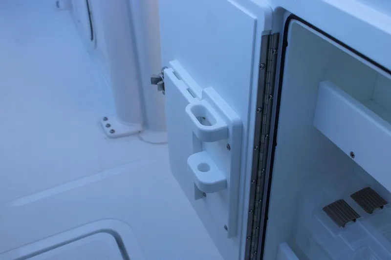 Slide: The Image of Open storage compartment on 2026 Sea Hunt Gamefish 25 boat, showcasing interior details. - 21