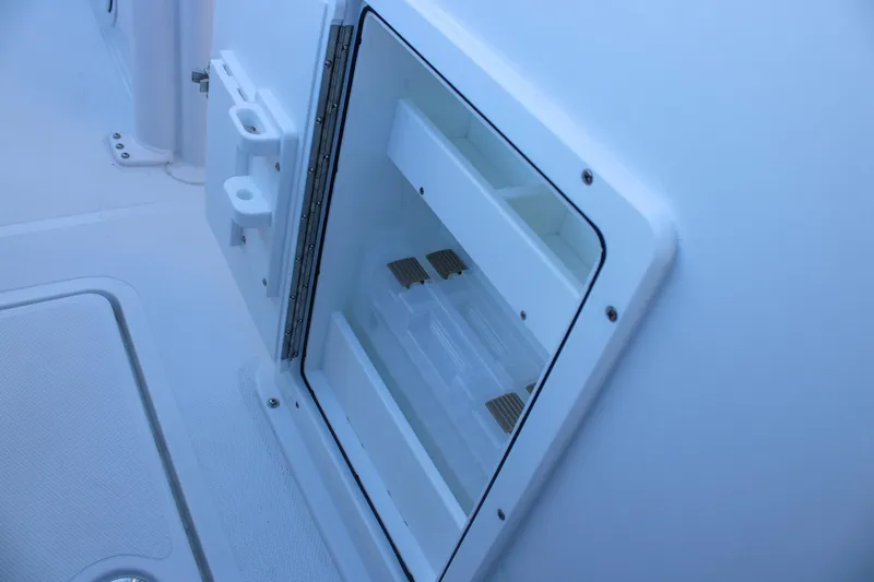 Slide: The Image of 2026 Sea Hunt Gamefish 25 boat storage compartment detail. - 22
