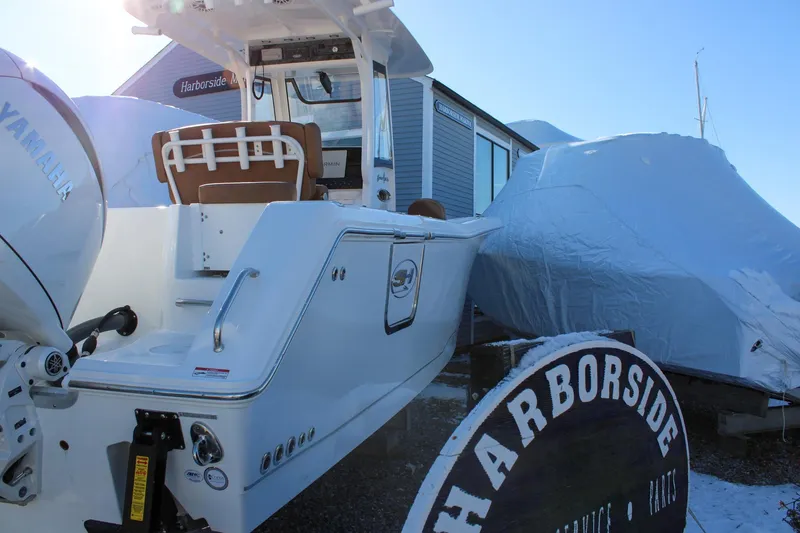 Slide: The Image of 2026 Sea Hunt Gamefish 25 boat at Harborside, covered for winter storage. - 3
