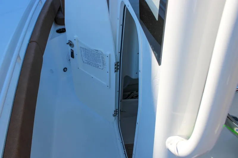 Slide: The Image of 2026 Sea Hunt Gamefish 25 interior view with open cabin door. - 30