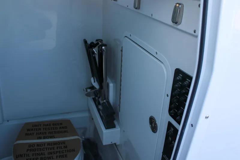 Slide: The Image of Interior of 2026 Sea Hunt Gamefish 25 boat with control panel and storage. - 32