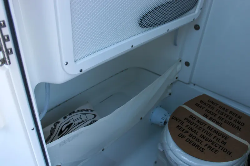 Slide: The Image of Interior storage compartment of 2026 Sea Hunt Gamefish 25 boat with protective cover. - 33
