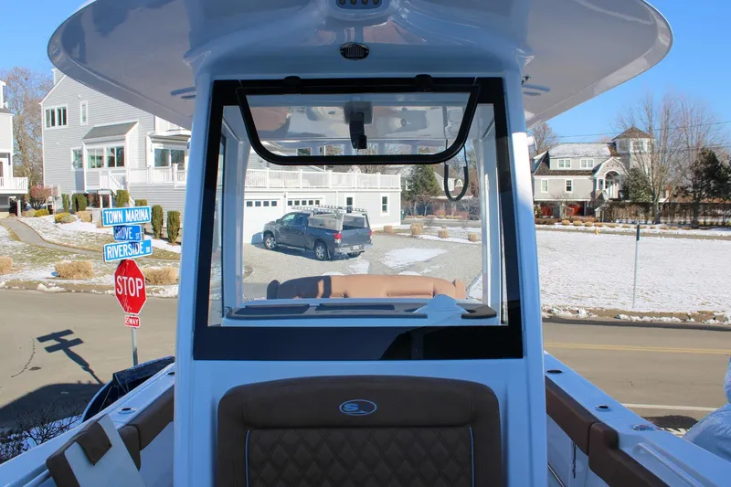 Slide: The Image of 2026 Sea Hunt Gamefish 25 boat interior with street view, stop sign, and residential area. - 38